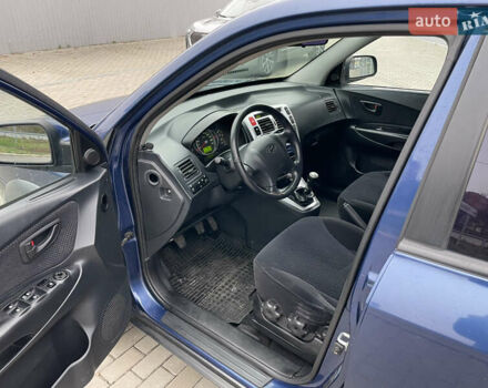 Синий Хендай Туксон, объемом двигателя 1.98 л и пробегом 163 тыс. км за 8000 $, фото 8 на Automoto.ua