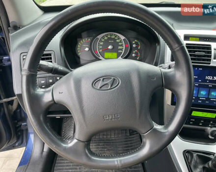 Синий Хендай Туксон, объемом двигателя 1.98 л и пробегом 163 тыс. км за 8000 $, фото 23 на Automoto.ua