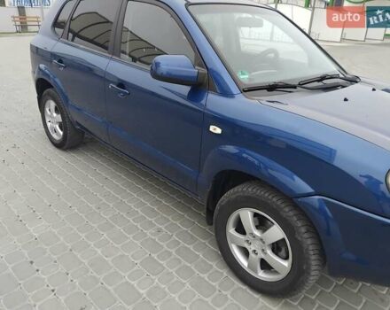 Синий Хендай Туксон, объемом двигателя 1.98 л и пробегом 201 тыс. км за 9400 $, фото 5 на Automoto.ua