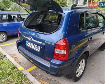 Синій Хендай Туксон, об'ємом двигуна 1.98 л та пробігом 258 тис. км за 8600 $, фото 4 на Automoto.ua