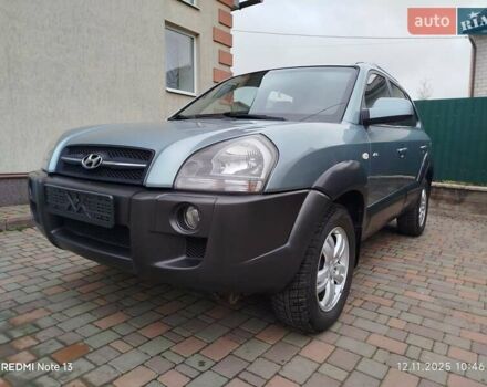Синий Хендай Туксон, объемом двигателя 2 л и пробегом 213 тыс. км за 8900 $, фото 4 на Automoto.ua
