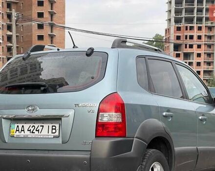Синий Хендай Туксон, объемом двигателя 2.7 л и пробегом 220 тыс. км за 7900 $, фото 5 на Automoto.ua
