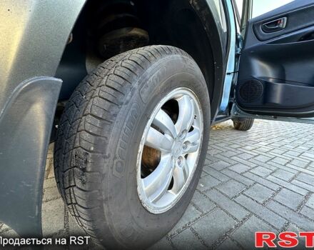 Хендай Туксон 2008 у Кременчуге на Automoto.ua Синій Хендай Туксон, об'ємом двигуна 2 л та пробігом 233 тис. км за 8300 $, фото 12 на Automoto.ua