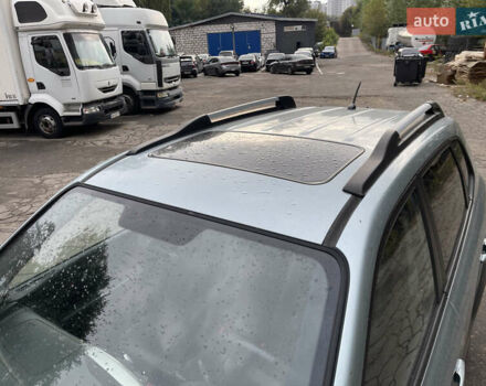 Синий Хендай Туксон, объемом двигателя 2.7 л и пробегом 220 тыс. км за 7900 $, фото 6 на Automoto.ua