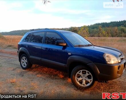 Синий Хендай Туксон, объемом двигателя 2 л и пробегом 220 тыс. км за 8500 $, фото 3 на Automoto.ua