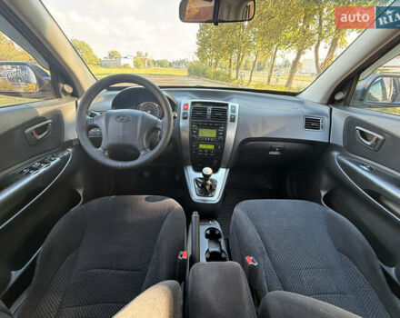 Синий Хендай Туксон, объемом двигателя 2 л и пробегом 168 тыс. км за 7500 $, фото 12 на Automoto.ua