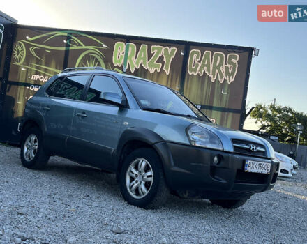 Синий Хендай Туксон, объемом двигателя 2 л и пробегом 317 тыс. км за 9600 $, фото 4 на Automoto.ua
