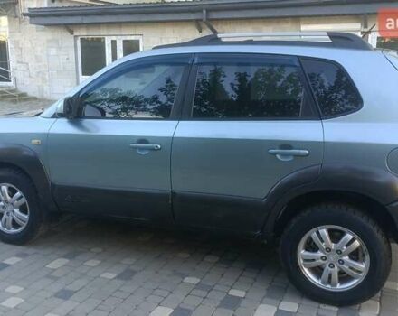 Синий Хендай Туксон, объемом двигателя 1.98 л и пробегом 183 тыс. км за 6700 $, фото 6 на Automoto.ua
