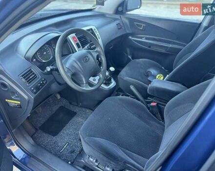 Синий Хендай Туксон, объемом двигателя 1.98 л и пробегом 178 тыс. км за 8700 $, фото 16 на Automoto.ua