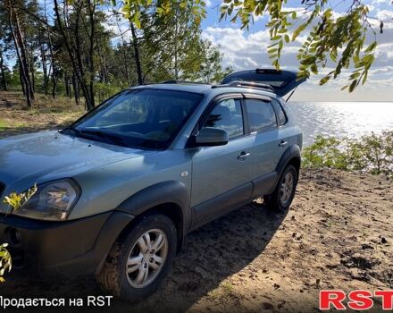 Синий Хендай Туксон, объемом двигателя 2 л и пробегом 233 тыс. км за 8300 $, фото 1 на Automoto.ua