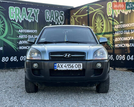 Синий Хендай Туксон, объемом двигателя 2 л и пробегом 317 тыс. км за 9600 $, фото 3 на Automoto.ua