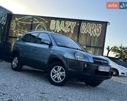 Синий Хендай Туксон, объемом двигателя 2 л и пробегом 317 тыс. км за 9600 $, фото 1 на Automoto.ua