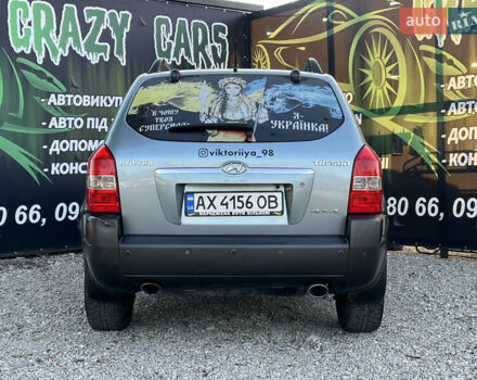 Синий Хендай Туксон, объемом двигателя 2 л и пробегом 317 тыс. км за 9600 $, фото 6 на Automoto.ua