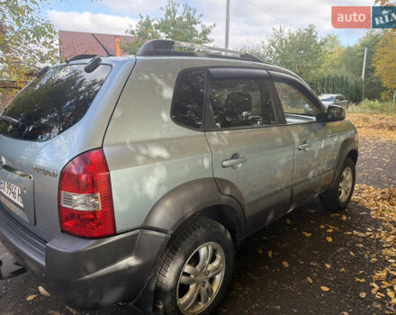 Синий Хендай Туксон, объемом двигателя 1.98 л и пробегом 200 тыс. км за 7700 $, фото 9 на Automoto.ua
