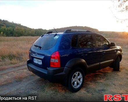 Синий Хендай Туксон, объемом двигателя 2 л и пробегом 220 тыс. км за 8500 $, фото 2 на Automoto.ua
