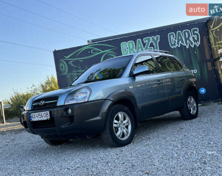 Синий Хендай Туксон, объемом двигателя 2 л и пробегом 317 тыс. км за 9600 $, фото 2 на Automoto.ua