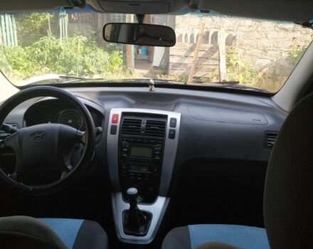 Синий Хендай Туксон, объемом двигателя 2 л и пробегом 200 тыс. км за 7600 $, фото 12 на Automoto.ua