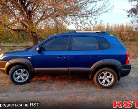 Синий Хендай Туксон, объемом двигателя 2 л и пробегом 220 тыс. км за 8500 $, фото 1 на Automoto.ua