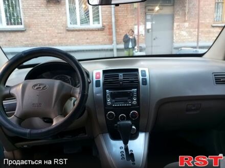 Синий Хендай Туксон, объемом двигателя 2 л и пробегом 273 тыс. км за 4500 $, фото 1 на Automoto.ua
