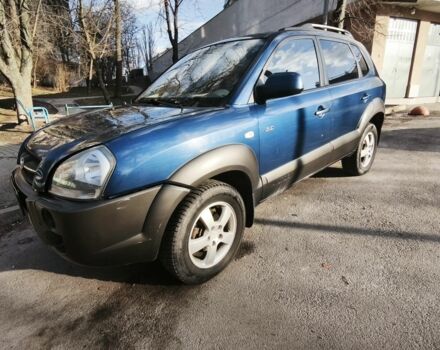 Синий Хендай Туксон, объемом двигателя 2 л и пробегом 243 тыс. км за 4000 $, фото 1 на Automoto.ua