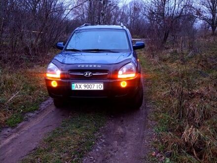 Синий Хендай Туксон, объемом двигателя 2 л и пробегом 219 тыс. км за 8400 $, фото 1 на Automoto.ua