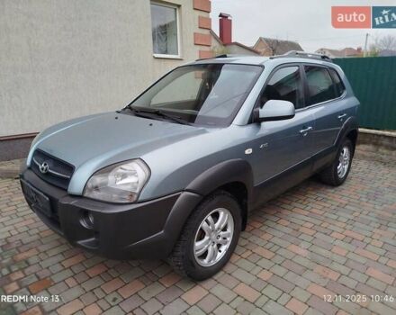 Синий Хендай Туксон, объемом двигателя 2 л и пробегом 213 тыс. км за 8900 $, фото 1 на Automoto.ua