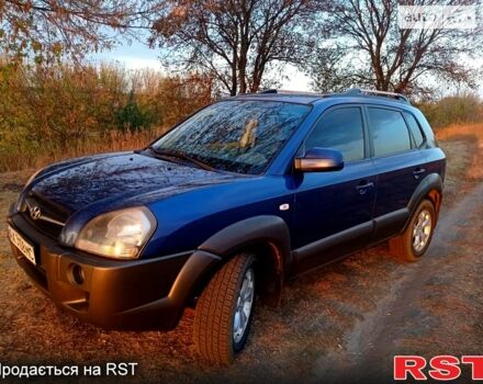 Синий Хендай Туксон, объемом двигателя 2 л и пробегом 200 тыс. км за 9000 $, фото 1 на Automoto.ua