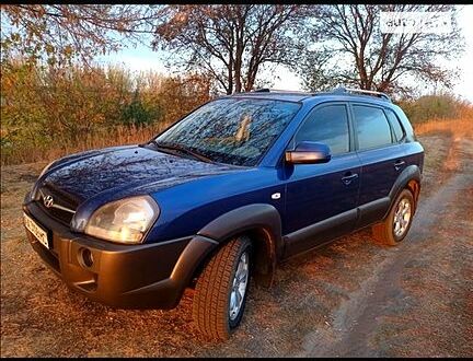 Синий Хендай Туксон, объемом двигателя 2 л и пробегом 220 тыс. км за 8500 $, фото 1 на Automoto.ua