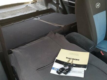 Синий Хендай Туксон, объемом двигателя 2 л и пробегом 200 тыс. км за 7600 $, фото 1 на Automoto.ua