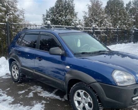 Синий Хендай Туксон, объемом двигателя 2 л и пробегом 172 тыс. км за 8000 $, фото 1 на Automoto.ua