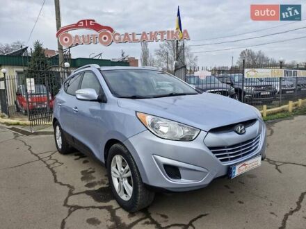 Синий Хендай Туксон, объемом двигателя 2.4 л и пробегом 244 тыс. км за 12599 $, фото 1 на Automoto.ua