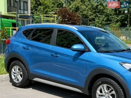 Синій Хендай Туксон, об'ємом двигуна 2 л та пробігом 122 тис. км за 18594 $, фото 1 на Automoto.ua