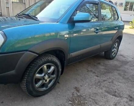 Зеленый Хендай Туксон, объемом двигателя 1.98 л и пробегом 288 тыс. км за 6500 $, фото 3 на Automoto.ua