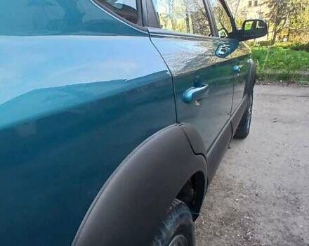 Зеленый Хендай Туксон, объемом двигателя 1.98 л и пробегом 288 тыс. км за 6500 $, фото 7 на Automoto.ua