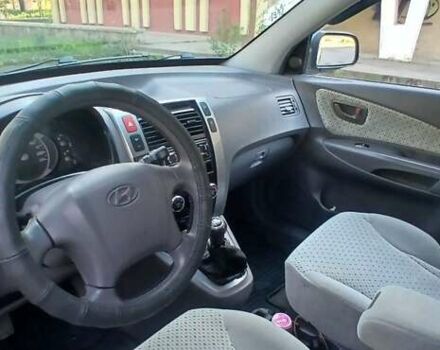 Зеленый Хендай Туксон, объемом двигателя 1.98 л и пробегом 288 тыс. км за 6500 $, фото 13 на Automoto.ua