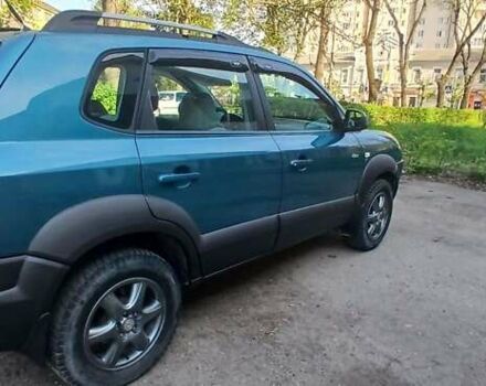 Зеленый Хендай Туксон, объемом двигателя 1.98 л и пробегом 288 тыс. км за 6500 $, фото 8 на Automoto.ua