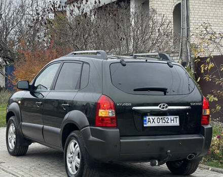 Зеленый Хендай Туксон, объемом двигателя 1.98 л и пробегом 261 тыс. км за 7499 $, фото 19 на Automoto.ua