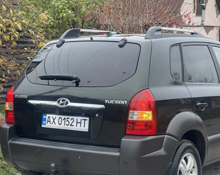 Зеленый Хендай Туксон, объемом двигателя 1.98 л и пробегом 261 тыс. км за 7499 $, фото 24 на Automoto.ua