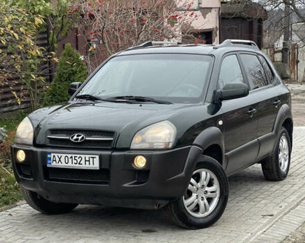 Зеленый Хендай Туксон, объемом двигателя 1.98 л и пробегом 261 тыс. км за 7499 $, фото 9 на Automoto.ua