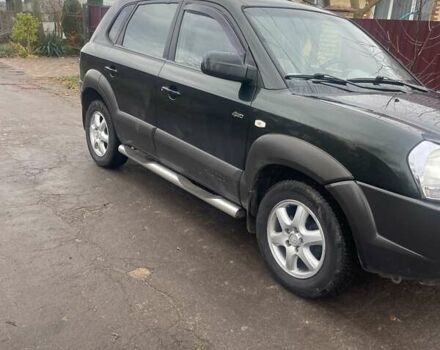 Зеленый Хендай Туксон, объемом двигателя 2 л и пробегом 201 тыс. км за 7600 $, фото 6 на Automoto.ua