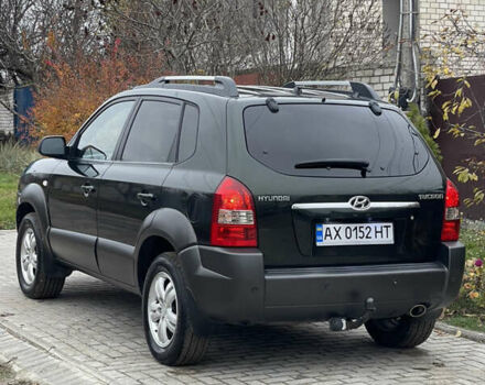 Зеленый Хендай Туксон, объемом двигателя 1.98 л и пробегом 261 тыс. км за 7499 $, фото 20 на Automoto.ua