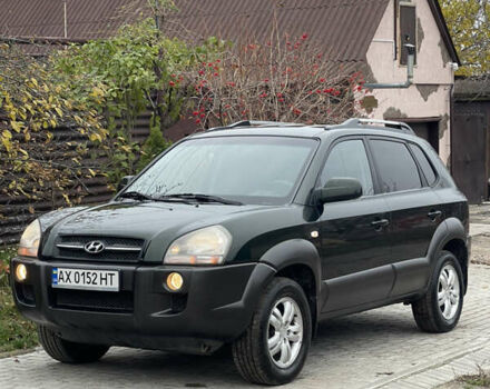 Зеленый Хендай Туксон, объемом двигателя 1.98 л и пробегом 261 тыс. км за 7499 $, фото 22 на Automoto.ua