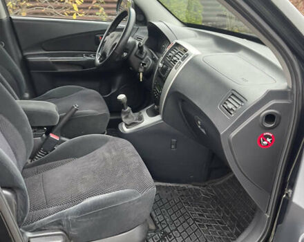 Зеленый Хендай Туксон, объемом двигателя 1.98 л и пробегом 261 тыс. км за 7499 $, фото 133 на Automoto.ua