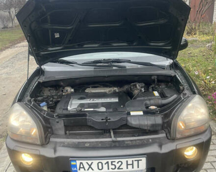 Зеленый Хендай Туксон, объемом двигателя 1.98 л и пробегом 261 тыс. км за 7499 $, фото 80 на Automoto.ua