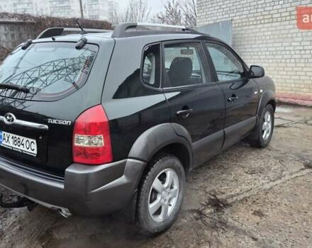 Зеленый Хендай Туксон, объемом двигателя 1.98 л и пробегом 241 тыс. км за 6900 $, фото 3 на Automoto.ua