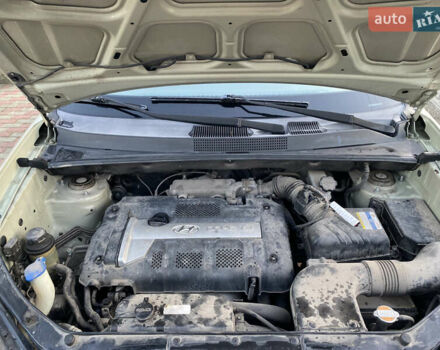 Зелений Хендай Туксон, об'ємом двигуна 1.99 л та пробігом 149 тис. км за 7300 $, фото 9 на Automoto.ua