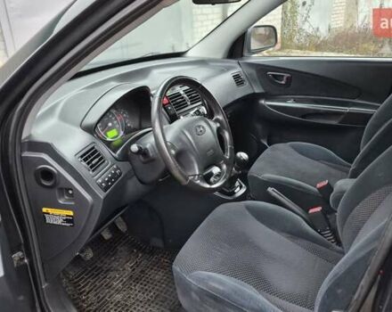 Зеленый Хендай Туксон, объемом двигателя 1.98 л и пробегом 241 тыс. км за 6900 $, фото 7 на Automoto.ua