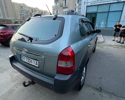 Зеленый Хендай Туксон, объемом двигателя 1.98 л и пробегом 205 тыс. км за 7700 $, фото 3 на Automoto.ua