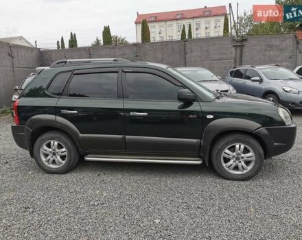 Зеленый Хендай Туксон, объемом двигателя 1.98 л и пробегом 363 тыс. км за 7400 $, фото 7 на Automoto.ua