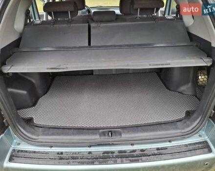 Зеленый Хендай Туксон, объемом двигателя 1.98 л и пробегом 129 тыс. км за 9200 $, фото 6 на Automoto.ua